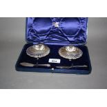 Pair of Birmingham silver shell form butter dishes with knives,