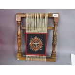 Small hardwood loom with salesman's small carpet sample