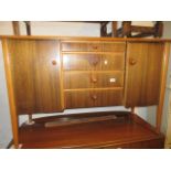 Mid 20th Century teak sideboard with four centre drawers flanked by cupboard doors,