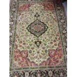 Small Sino Persian rug with a medallion and all-over floral design on a beige ground with borders