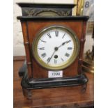 19th Century French walnut and ebonised mantel clock, the enamel dial with Roman numerals,