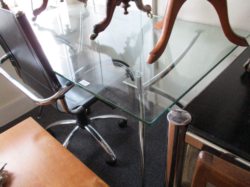 20th Century rectangular glass and polished steel dining table with outswept splay supports