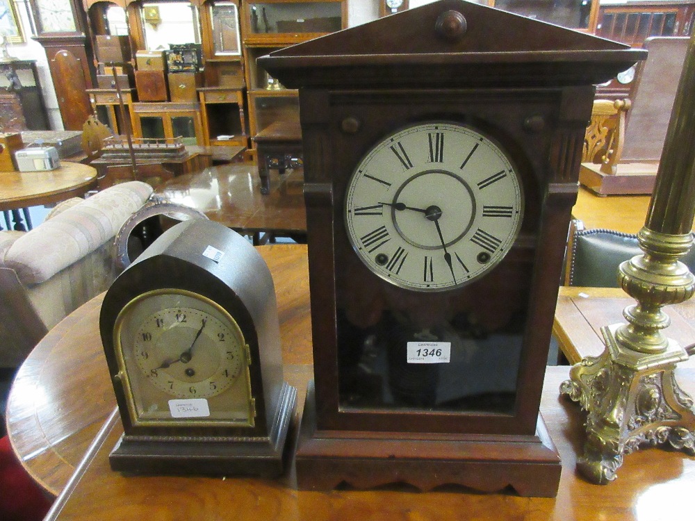 Mahogany mantel clock having circular dial with Roman numerals and two train movement striking on