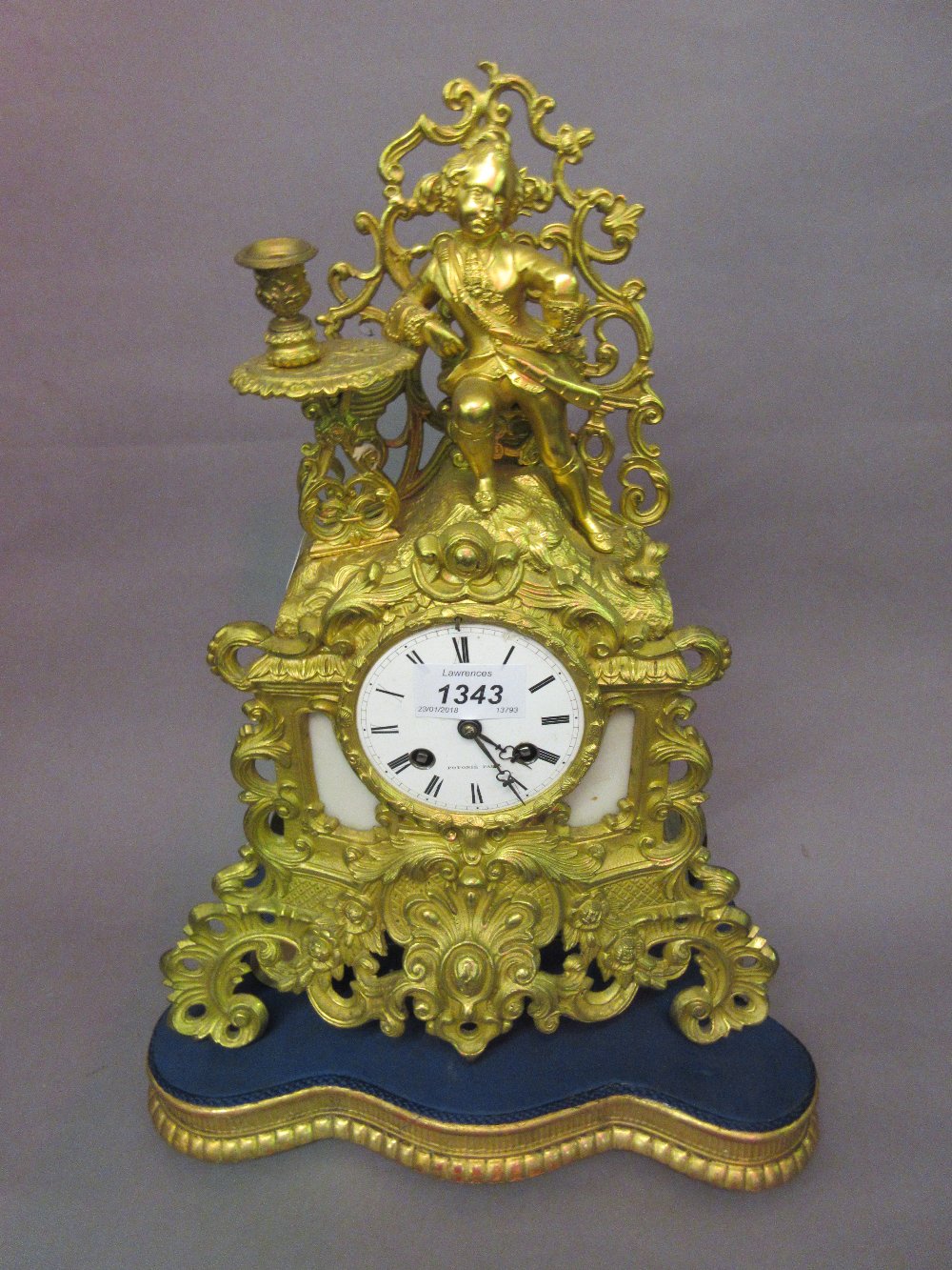 19th Century French ormolu mantel clock, the shaped case with a figural and candlestick surmount,