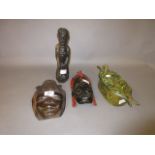 Two African wall masks, a carved figure,