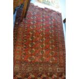 Tekke rug with three rows of nine gols on a wine ground with borders,