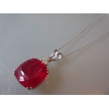 Large 18ct white gold treated ruby and diamond pendant on an 18ct white gold chain,