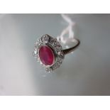 18ct White gold oval ruby and diamond cluster ring