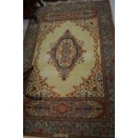 Indo Persian rug with central medallion design on an ivory ground with borders,