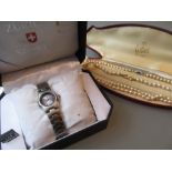 Two simulated pearl necklaces together with a quartz wristwatch in original box