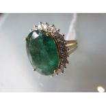 Large 18ct yellow gold oval emerald and diamond cluster ring, the emerald approximately 8.