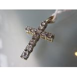 9ct Yellow gold crucifix set with diamond chips in illusion settings