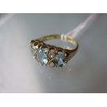 Yellow gold ring set three oval aquamarine and four diamonds