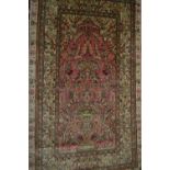 Small modern Persian silk prayer rug with a vase design on a pale pink ground with borders