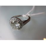 Platinum and diamond solitaire halo ring,