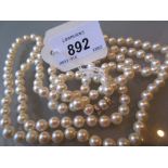 Single row cultured pearl necklace with 18ct gold and diamond set clasp