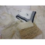 Bag containing a small quantity of various Christening gowns, lace etc.