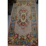 Small Chinese rug with beige ground together with a similar circular rug