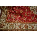 Red ground Kashan pattern machine carpet, 2.3m x 1.