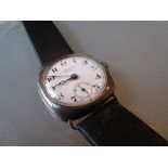 Silver cushion cased wristwatch by Kendal and Dent
