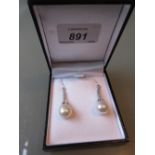 Pair of 18ct white gold pearl and diamond drop earrings set rose and brilliant cut diamonds