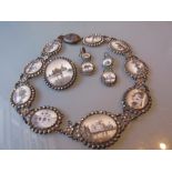 19th Century Indian white metal necklace inset with miniature hand painted views of various temples,