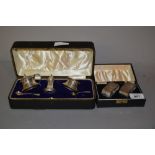 Cased pair of silver napkin rings,