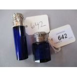 Two Bristol blue glass perfume bottles with ornate silver tops