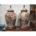 Pair of modern porcelain baluster form table lamps in the form of Imari temple jars with shades and