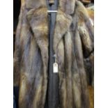Two ladies mid brown fur coats together with a similar half length jacket and stole