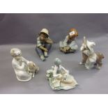 Pair of Lladro matt glazed figures of seated children (seconds - one at fault),