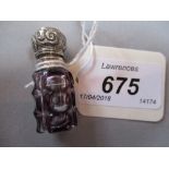 Miniature amethyst overlay perfume bottle with ornate white metal hinged lid and stopper,