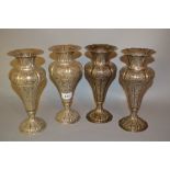 Set of four Continental silver (800 mark) baluster form pedestal vases with stylised floral