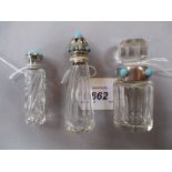 Three various clear glass perfume bottles with turquoise mounted white metal lids and collar mounts,