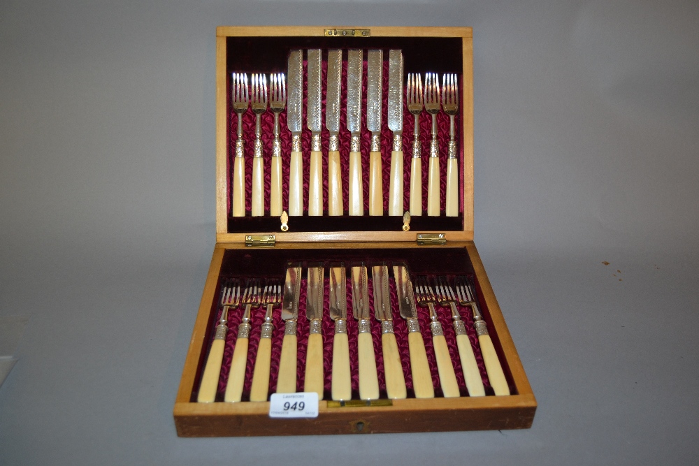 Mahogany cased set of twelve plated dessert knives and forks