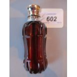 Victorian cut ruby glass waisted perfume bottle with plain white metal hinged lid engraved with