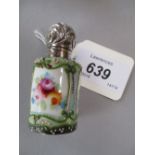 Porcelain perfume bottle decorated with three floral panels, the ornate silver hinged lid,