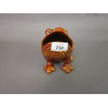 Burmantofts orange glazed pottery grotesque spoon warmer in the form of a frog with glass eyes
