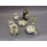 Derby type figure of Putto, various items of floral encrusted porcelain,
