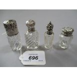 Group of four various cut glass perfume bottles with white metal mounts,