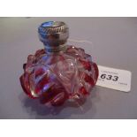 Red overlay and cut glass squat design perfume bottle with ornate white metal hinged top and
