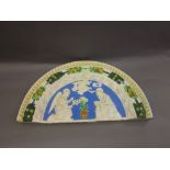 Della Robbia type relief moulded pottery plaque in the form of an arch depicting the Annunciation