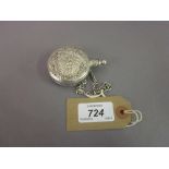 Continental silver (800 mark) perfume bottle with embossed decoration suspended from a chain