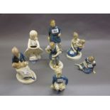Group of six Continental pottery figures of tradesmen and a mother and child