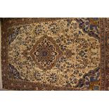 Iranian rug with centre medallion and all-over floral design with multiple borders on a beige