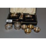 Cased three piece silver condiment set with two spoons,