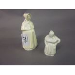 Small white glazed porcelain figural candle snuffer together with a pottery candle snuffer (at