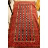 Turkish rug with five rows of gols and multiple borders on a wine ground,