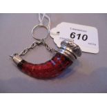 Unusual ruby glass cornucopia perfume bottle with ornate white metal mounts and attached chain,