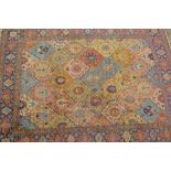 Tabriz carpet with an all-over tile and palmette design in shades of pale blue, ivory, beige, pink,